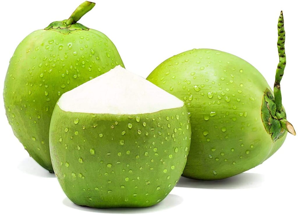 Fresh tender coconut water poured into a glass